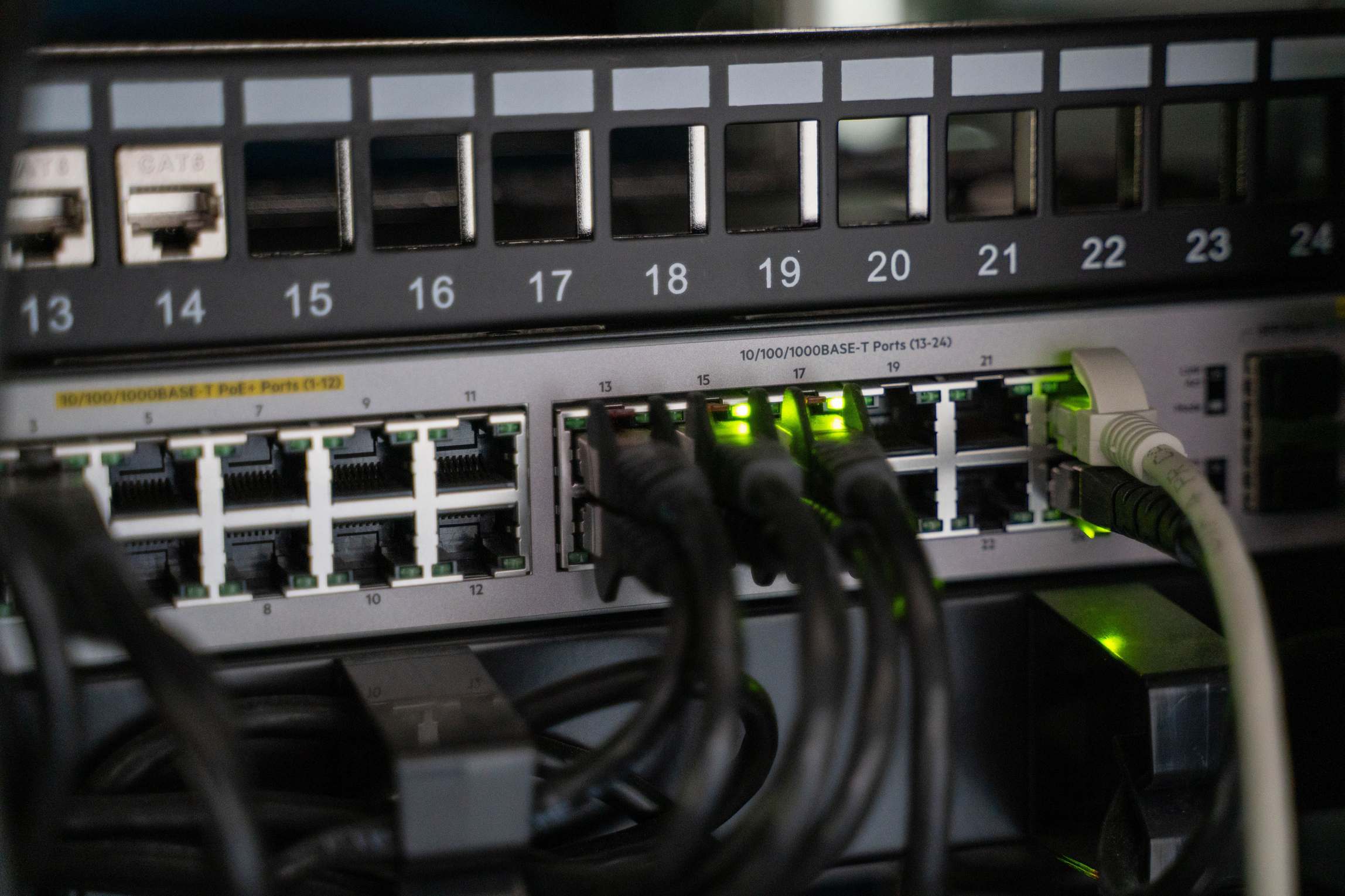 Server room with network racks and cabling, networking equipment with connected cables
